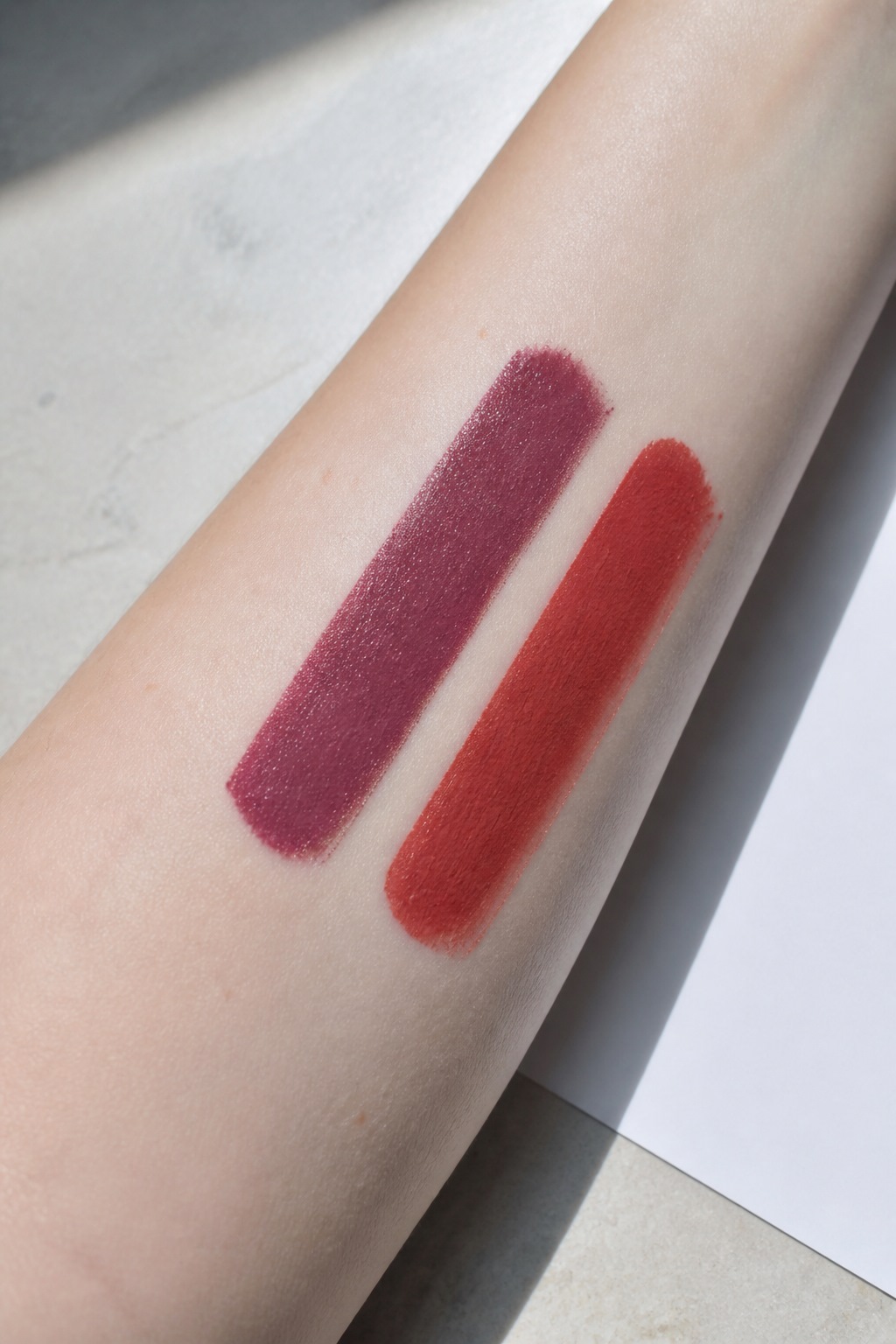 Berry and brick lipstick swatches in daylight