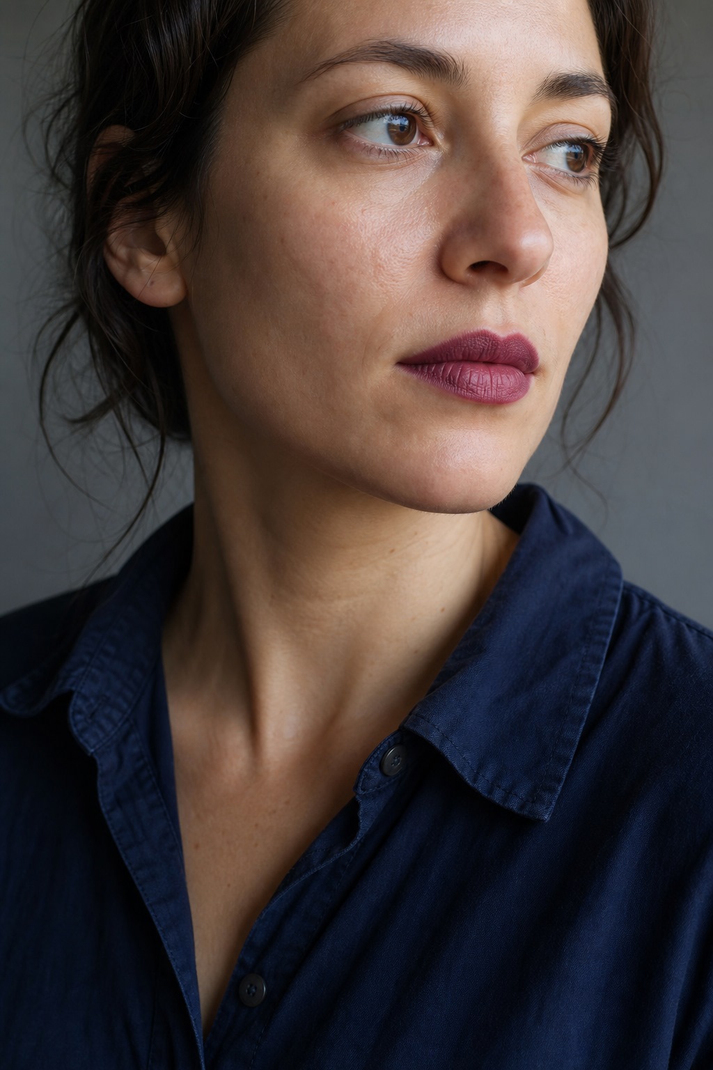 Berry or brick lipstick worn in daylight with simple clothing