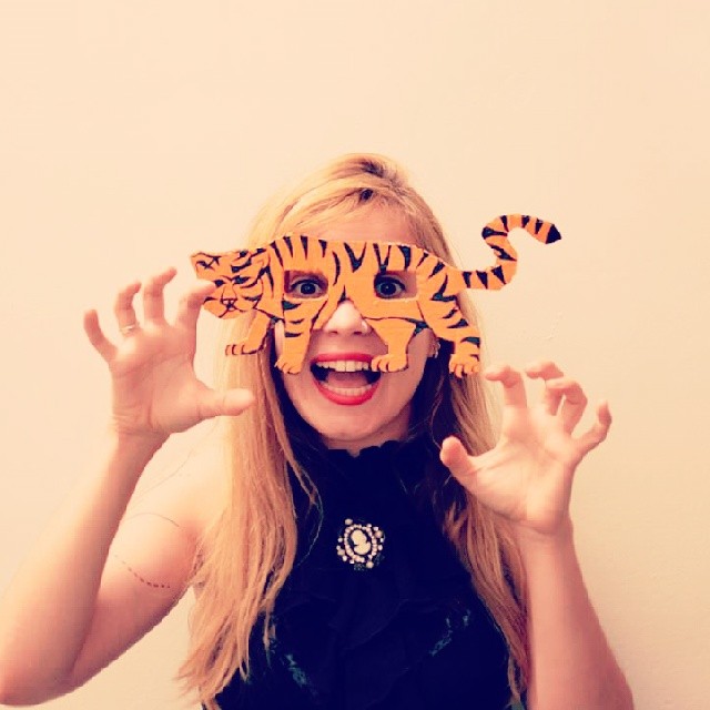 Orange tiger silhouette cardboard eye mask with claw pose