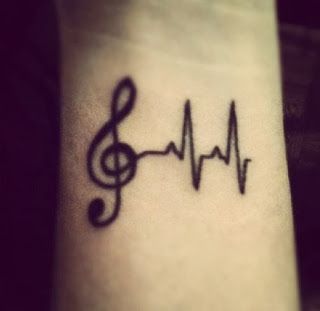 Custom music emblem tattoo