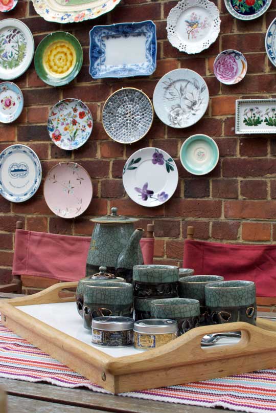 Plate wall above a console table