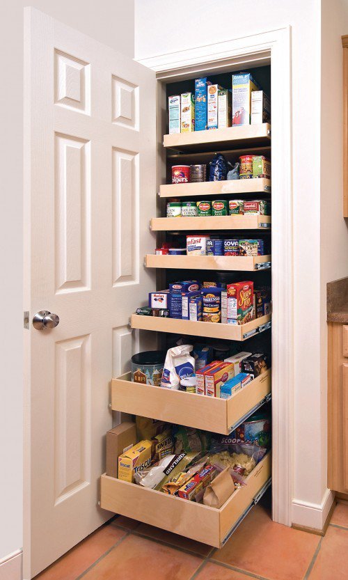 Floor-to-ceiling pantry shelving filled with kitchen staples
