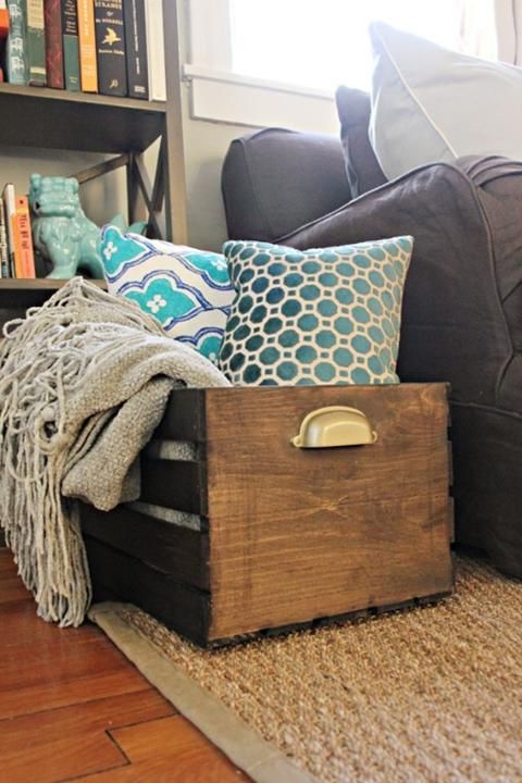Use wooden crate for keeping your blankets.