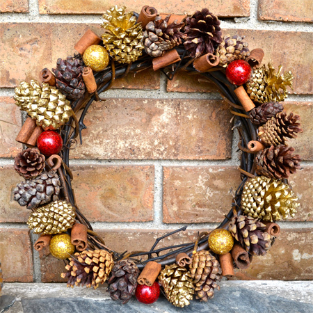 Handmade holiday wreath with mixed craft materials