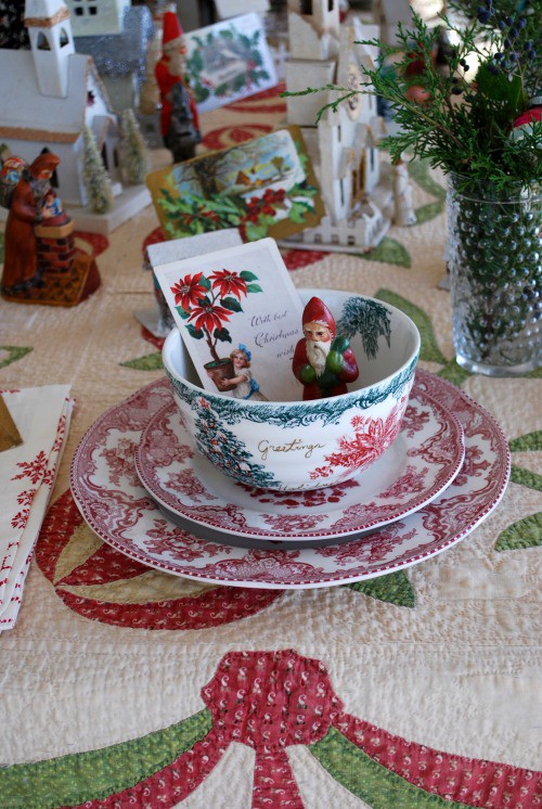 Natural Christmas table décor with wood and greenery cues