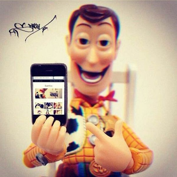 Toy figure with consumer gadgets