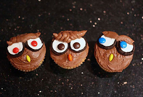 Owl cupcakes with cookie eyes and candy beaks