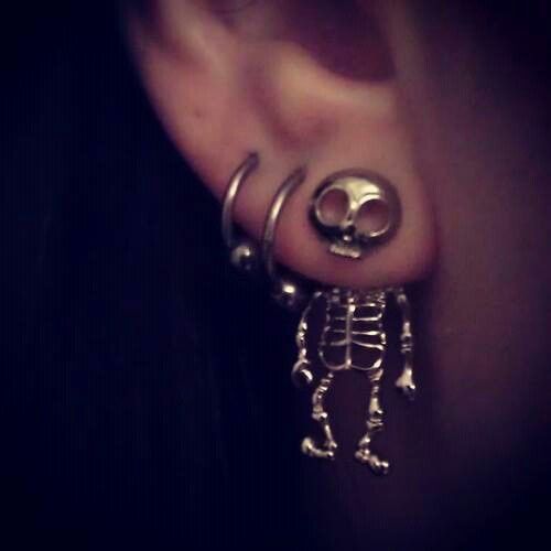 skeleton dangle earring with two hoop piercings