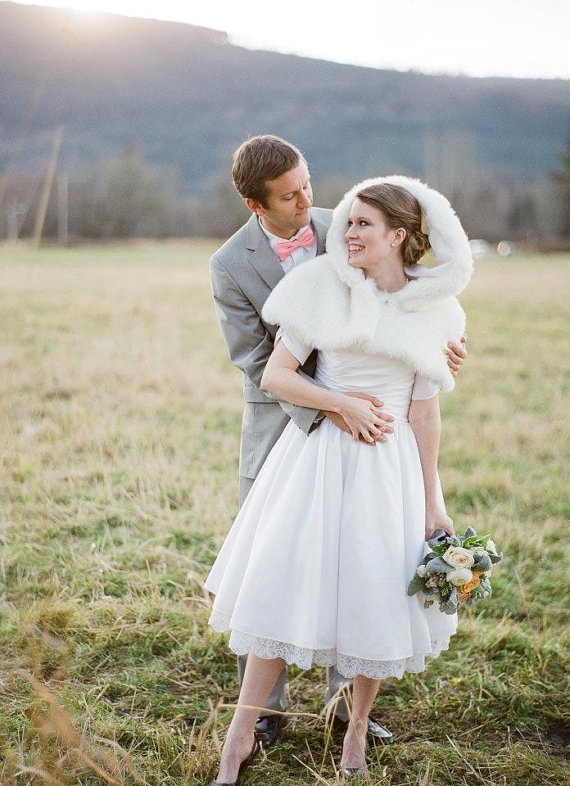 Winter bridal shrug over lace gown