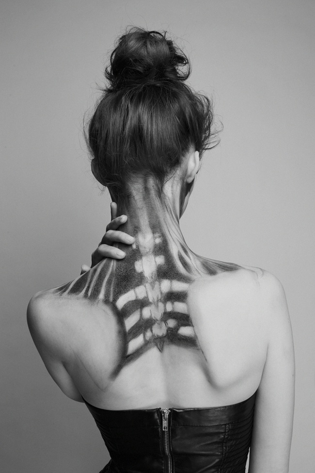 Anatomical skeleton vertebrae painted on back and neck