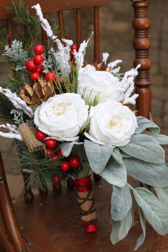 Winter bouquet held against coat