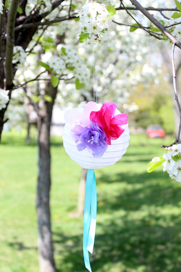 Paper flower lanterns with layered petal surfaces
