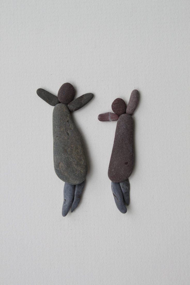 Two pebble figures jumping