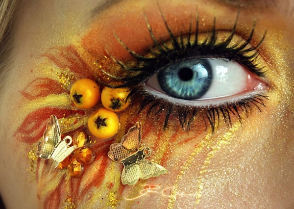 Detailed eye art with layered pigments and embellishments