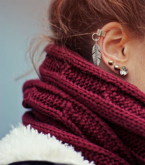 gold cuff with feather charm and crystal lobe