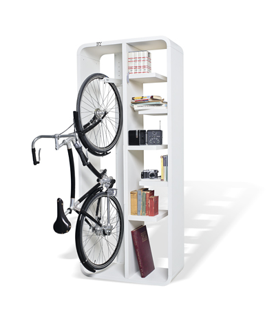 Tall white unit holding a vertical bicycle and books