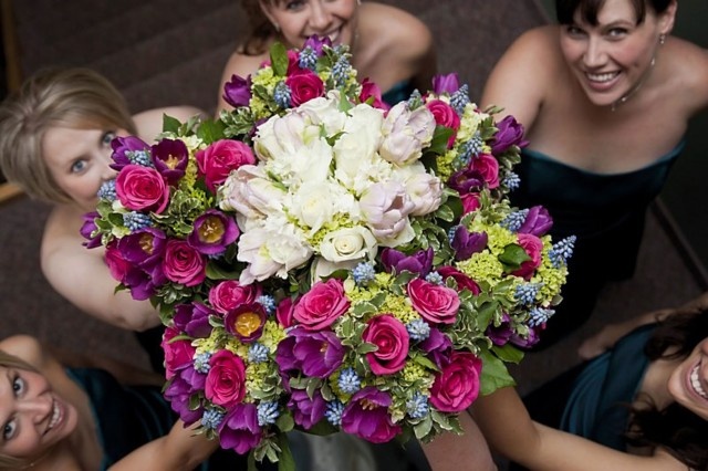 Bridesmaids laughing together candidly