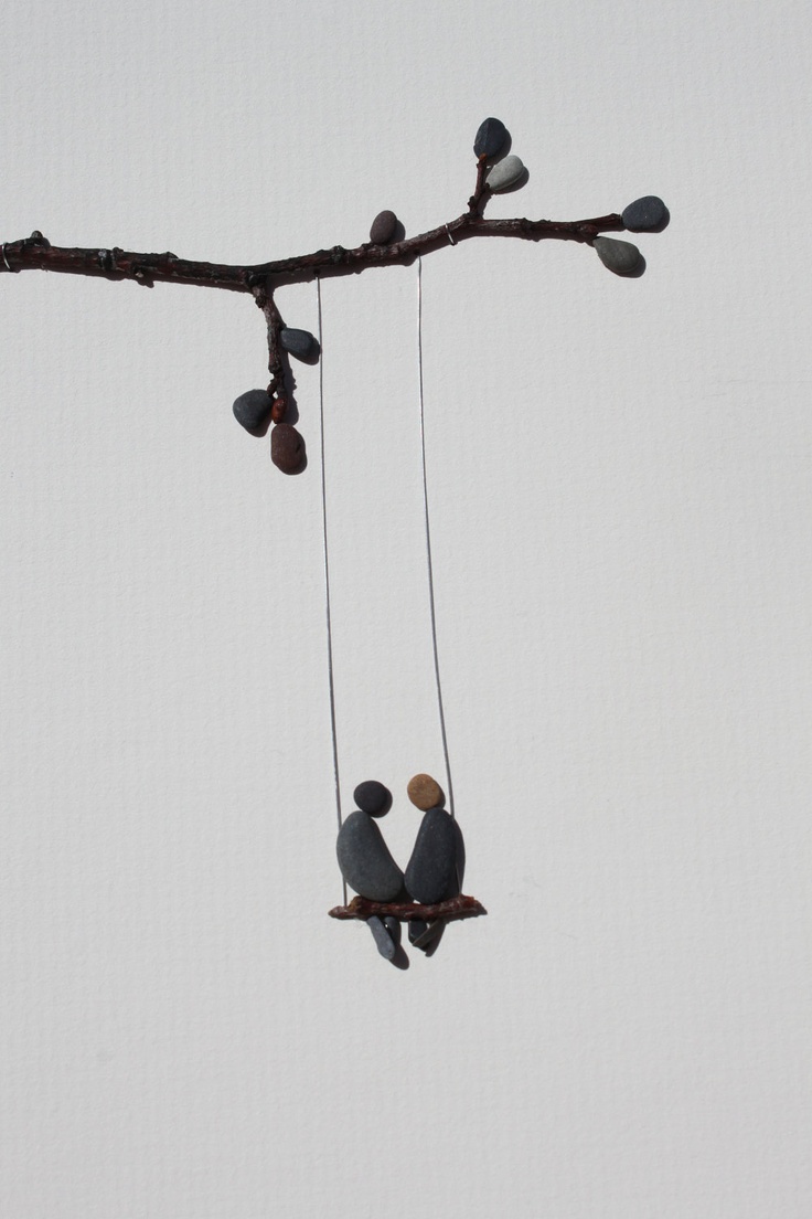 Pebble couple on a twig swing