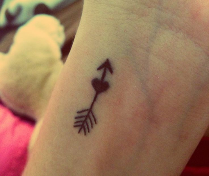 Creative arrow tattoo composition