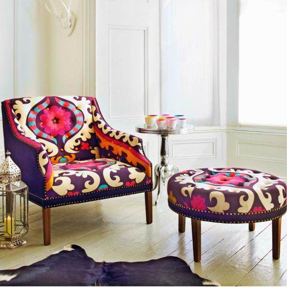 Upholstered armchair with distinctive shape