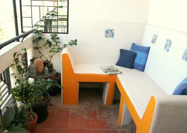 Outdoor balcony seating under soft light