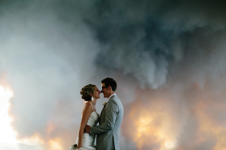 Intimate frame from the Wolber–Hartley wedding during the Bend wildfire evacuation