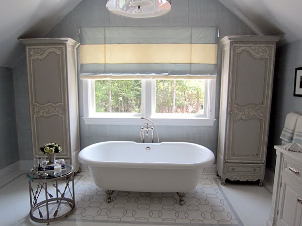 Warm-toned attic bathroom finishes