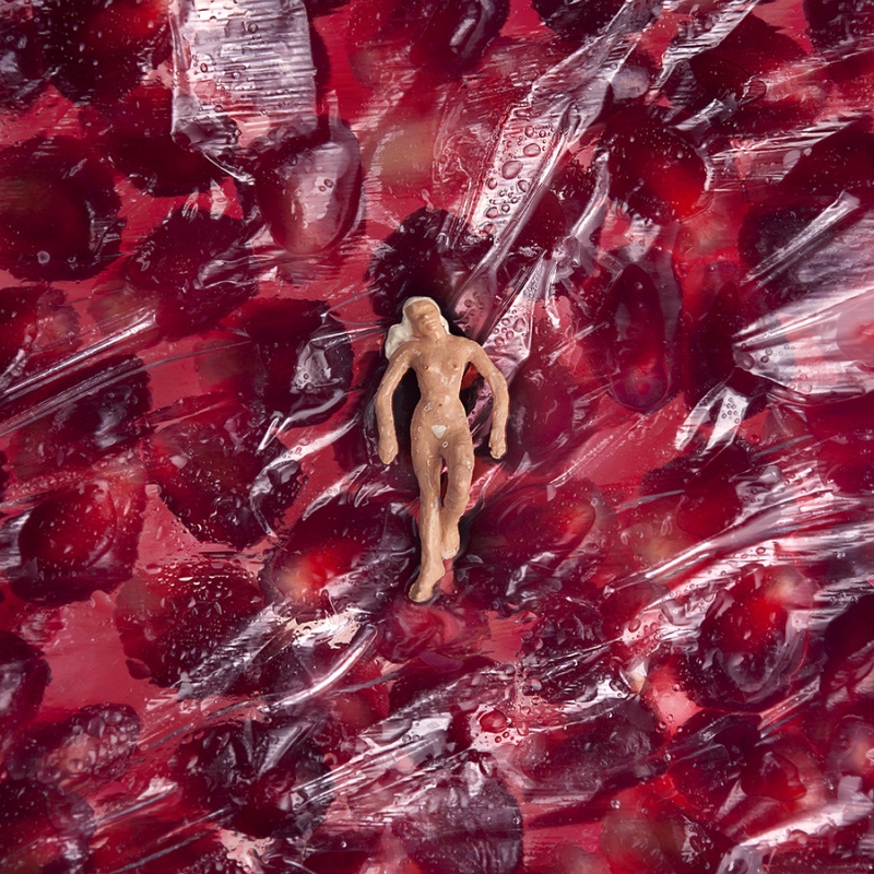 Miniature figures in a William Kass food landscape