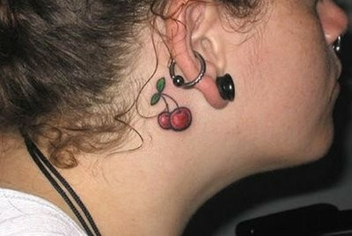 red cherries tattoo behind the ear