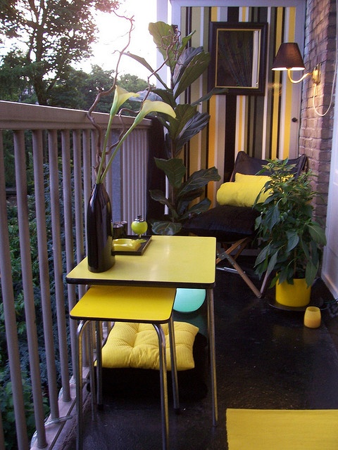 Balcony with layered seating and pots