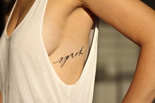Minimal line rib tattoo