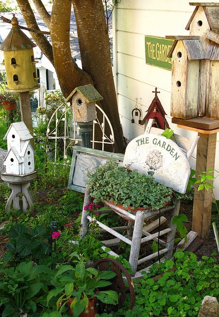 Garden corner with birdhouses and chair planter