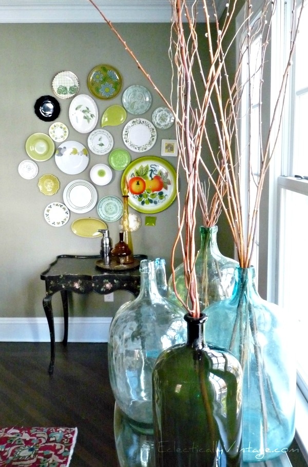 Painted paisley plates in a DIY wall arrangement