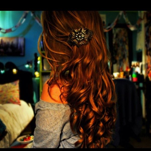 Shoulder-length red hair with soft curls