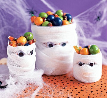 Mummy jars wrapped in gauze filled with Halloween candy