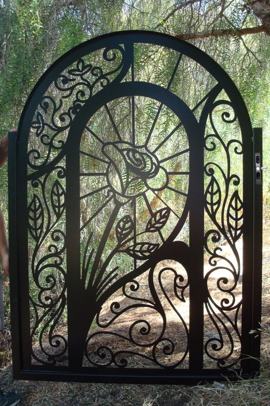 Decorative garden gate with patterned panels