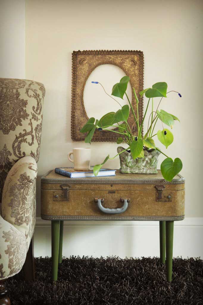 Tall stack of vintage suitcases