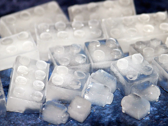 creative-ice-cubes9 LEGO brick shaped ice cubes on a blue surface