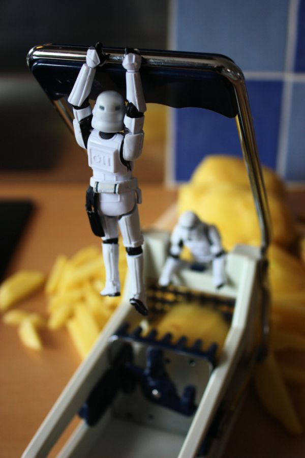 Ordinary-Day-Stormtrooper18 Stormtrooper hanging from a french fry cutter handle near potatoes