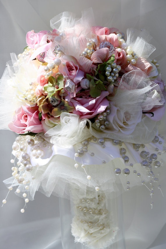 Tall pink bouquet held by a bride