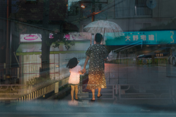 Taxi-window view of Yokohama layered in post