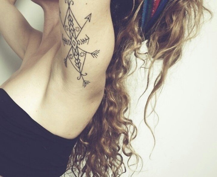 Arrow tattoo with unique pattern
