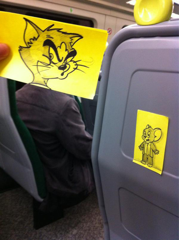 Cartoon face held over passenger