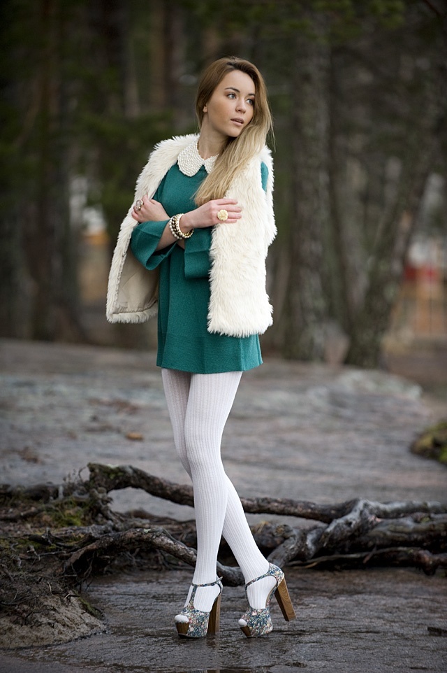 Fur-trimmed vest with fall layers