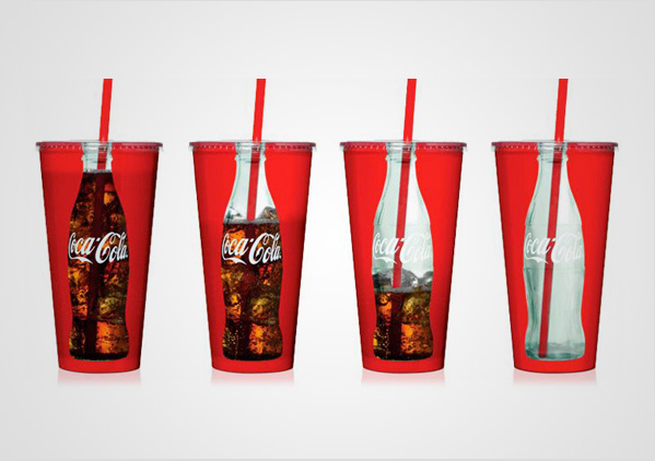 Coca-Cola cups with bottle-shaped windows showing soda levels