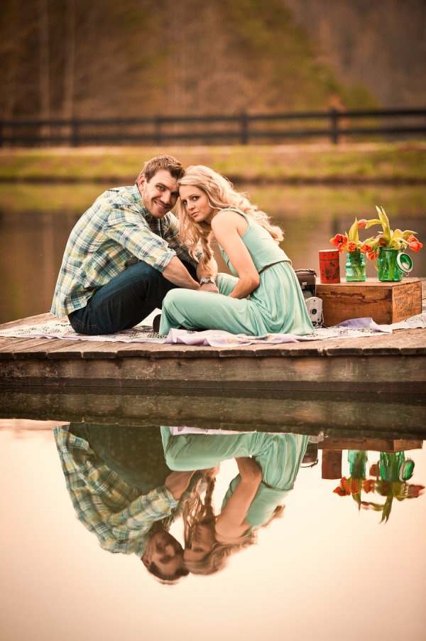 Picnic engagement portrait with countryside backdrop