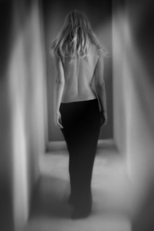 Editorial pose showing back and dress opening