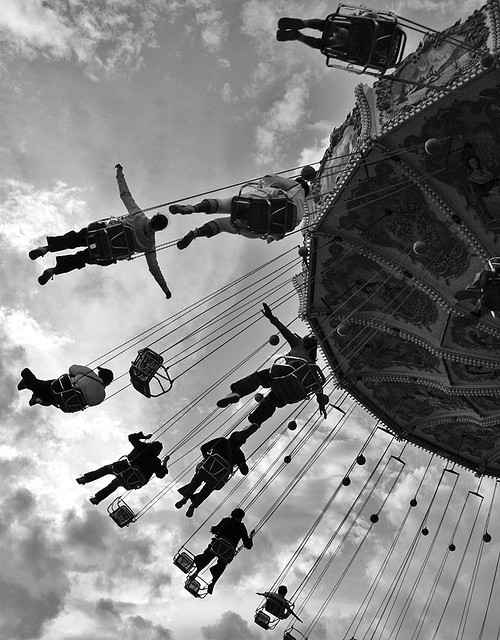 Chair swing carousel from below in black and white