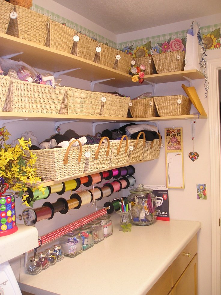 Craft room shelves filled with labeled supplies