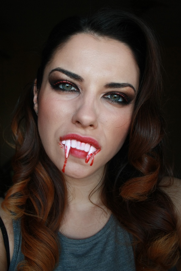 Classic vampire makeup with fangs and blood drips